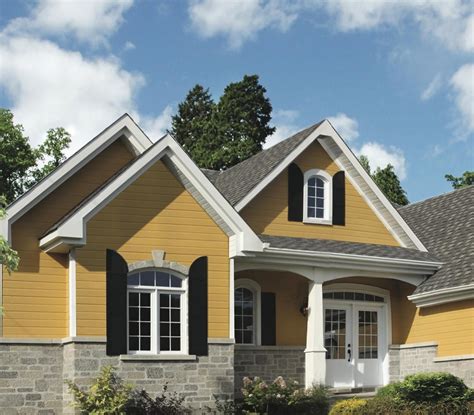 yellow house with brown metal roof|exterior house colors brown roof.